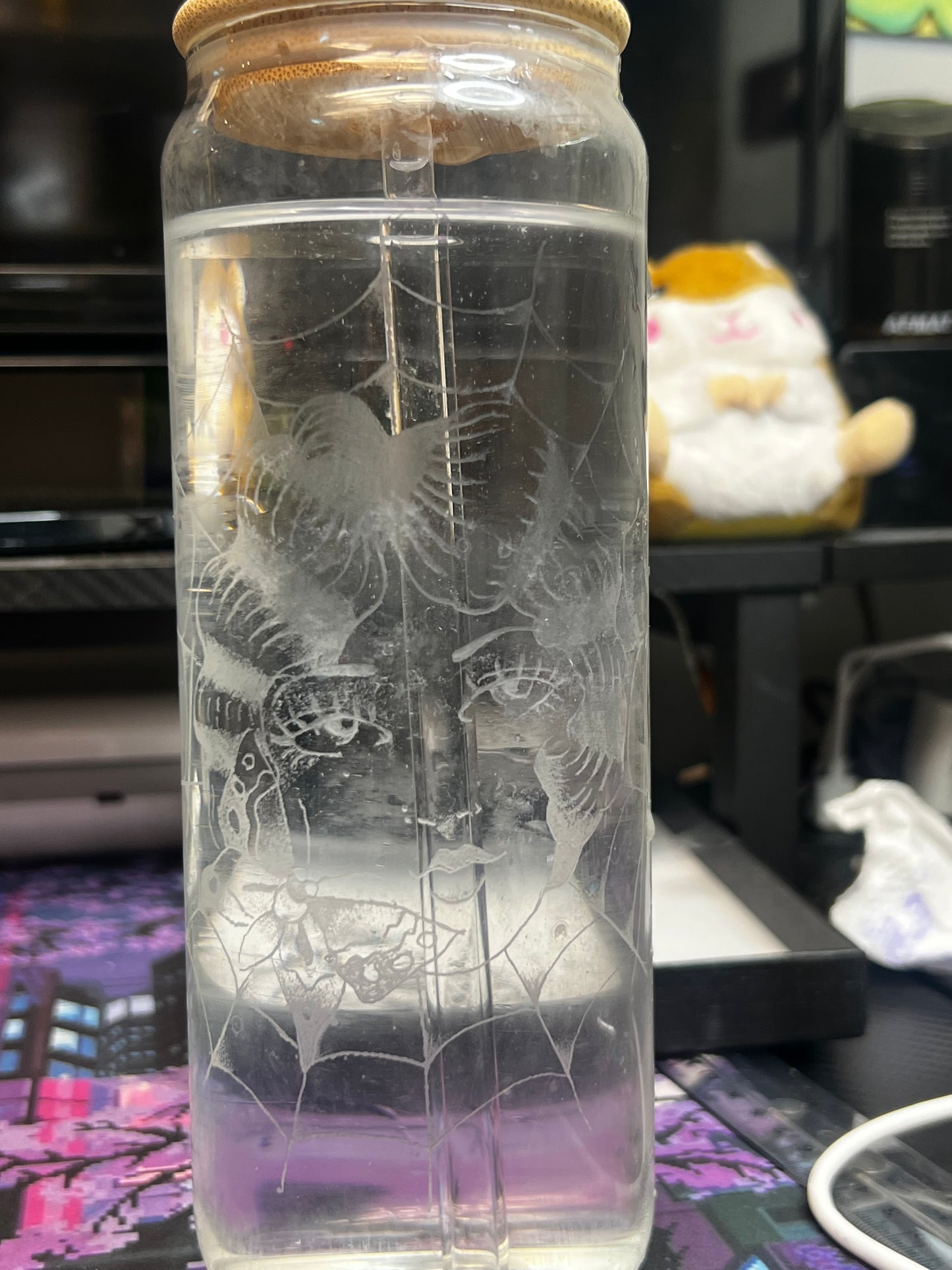 Glass cup with straw and wood lid