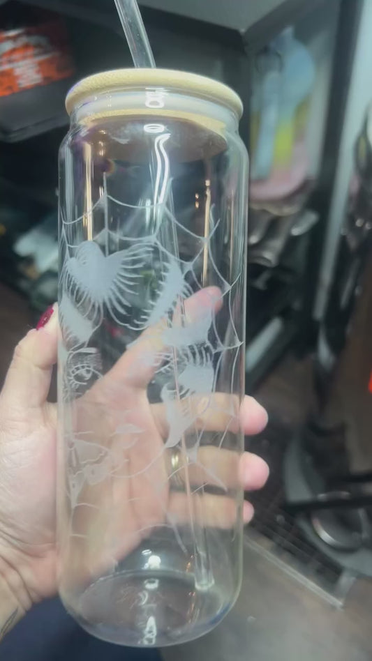 Glass cup with straw and wood lid